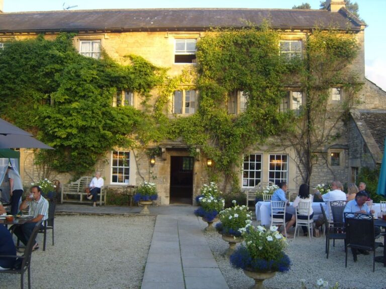 Outdoor dining area and main country house at Guyers House Hotel & Restaurant