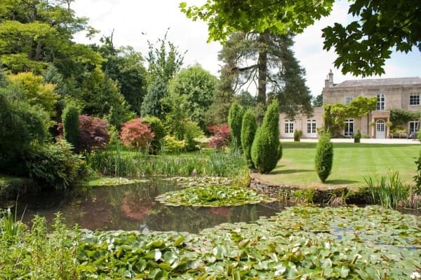 Pond, gardens and main country house at Guyers House Hotel & Restaurant